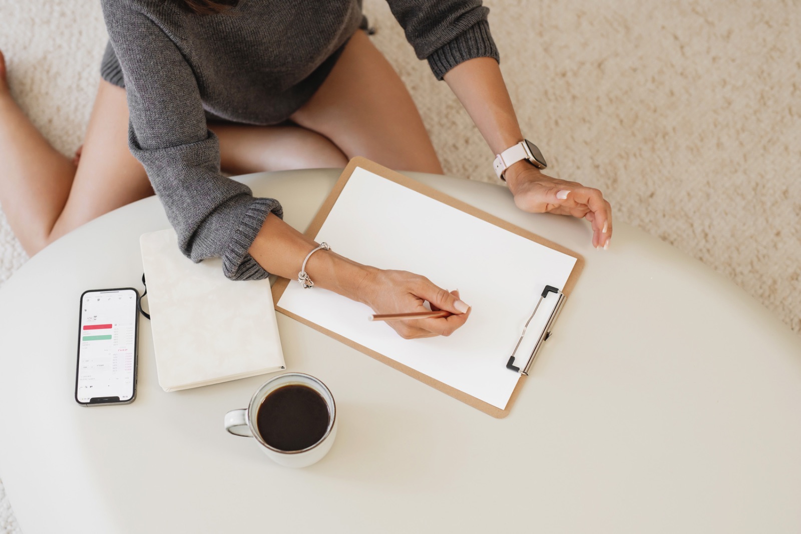 A bright morning workspace with coffee and a notebook