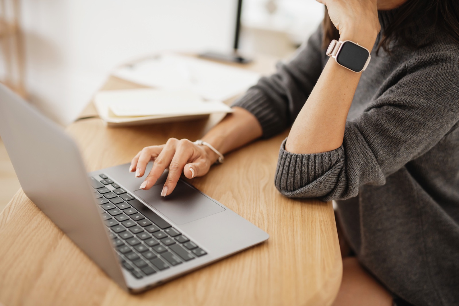 Working at a laptop, setting up a client workflow